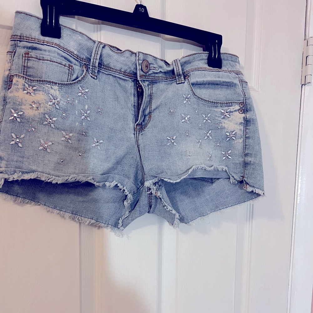 lei denim shorts frayed edges, stitching, and stones on the front size JR reg 11